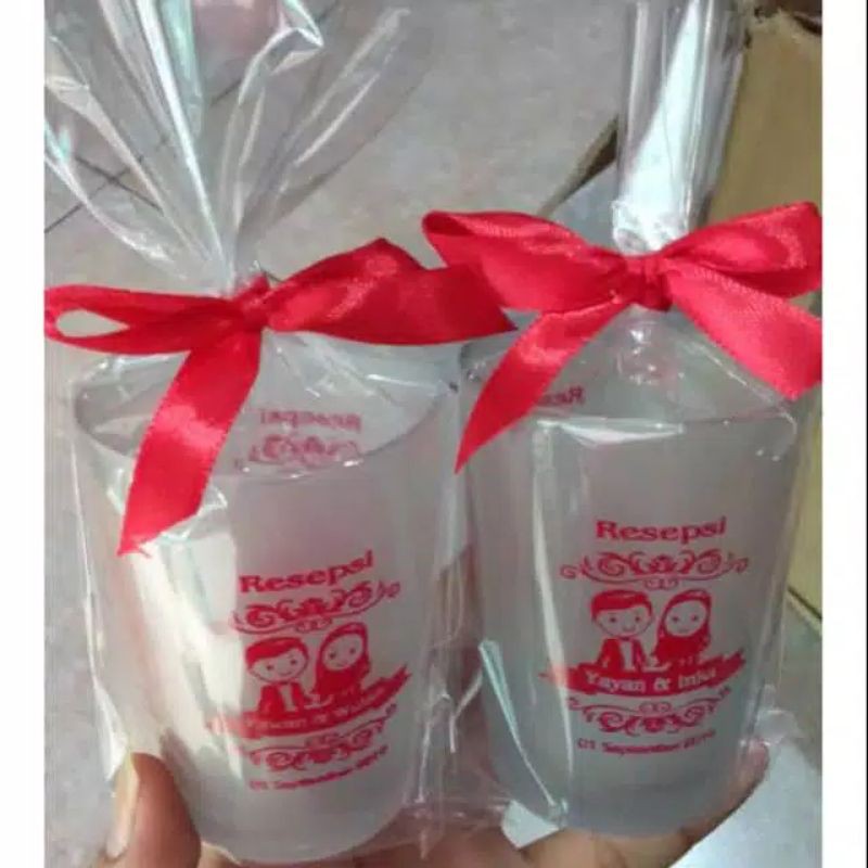 

SOUVENIR GELAS JAMU DOFF+SABLON+KEMAS PLASTIK IKAT PITA