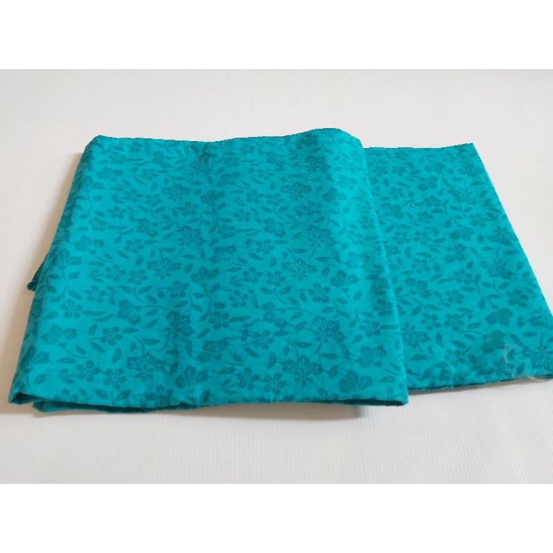 kain Embos Polos Biru Tosca
