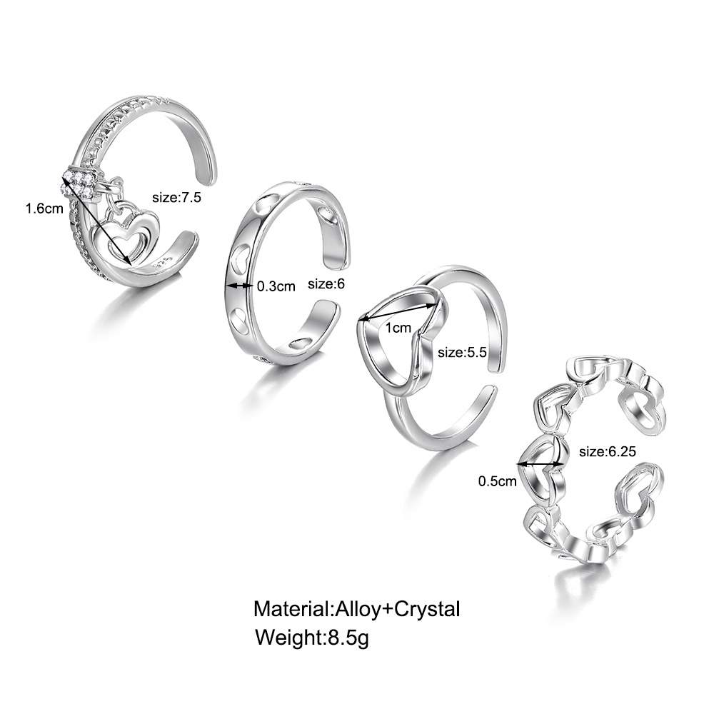 4pcs / Set Cincin Silver Desain Hati Hollow Hias Kristal Untuk Wanita