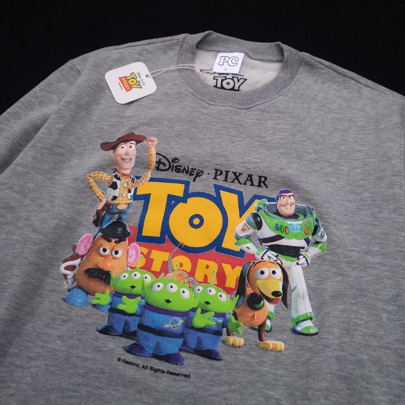 SWEATER PUBLIC CULTURE X TOY STORY PLAYMATES MISTY - M