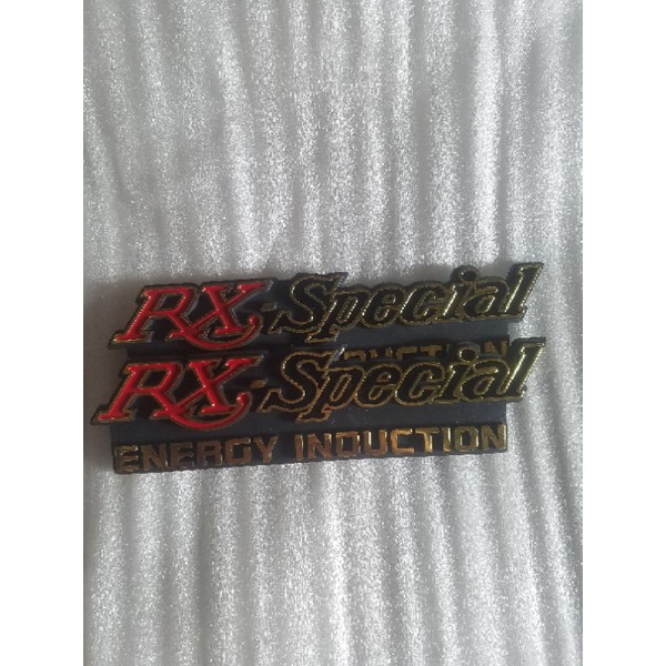 Emblem tepong Rx Spesial