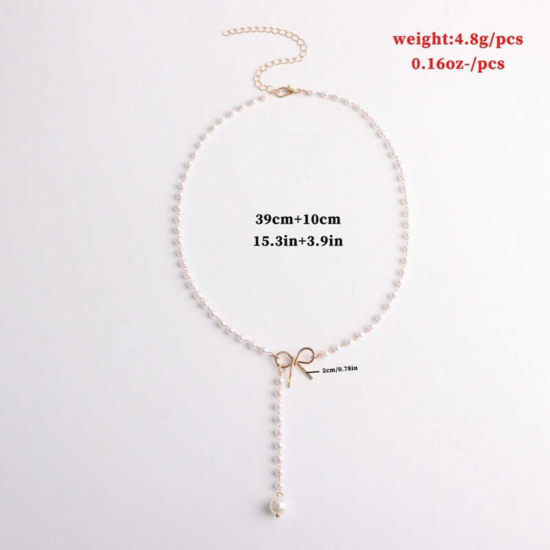 Kalung Liontin Mutiara Model Pita Rumbai Bahan Alloy Gaya Retro Untuk Wanita