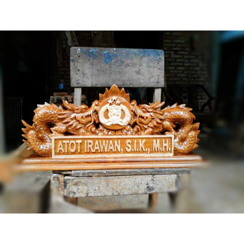papan nama ukir naga