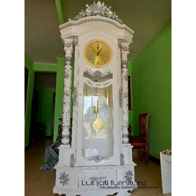 Lemari jam hias mawar kayu jati cat duco warna putih