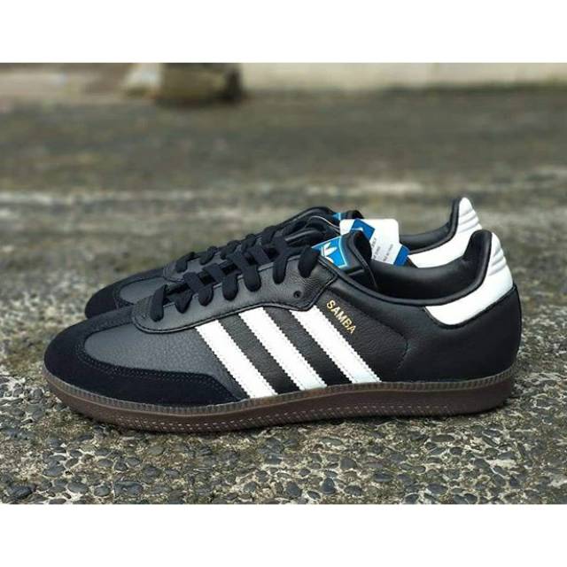 blue adidas samba shoes