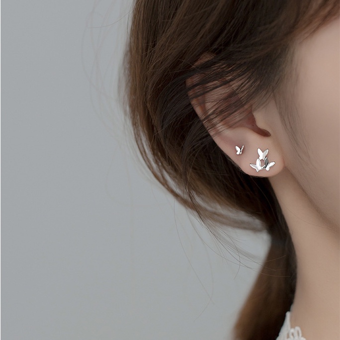 We Flower Anting Stud Desain Kupu-Kupu Asimetris Bahan S925 Silver Gaya Korea Untuk Wanita