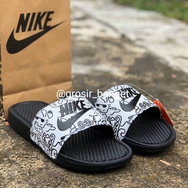 grey nike flip flops