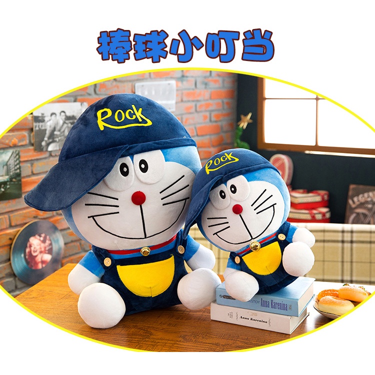 Boneka doraemon kostum pakai topi rock bahan plush