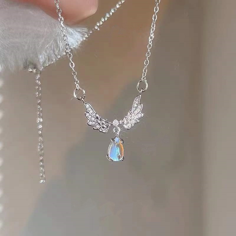 Kalung Rantai Klavikula Desain Sayap Aksen Moonstone Gaya Korea Untuk Wanita