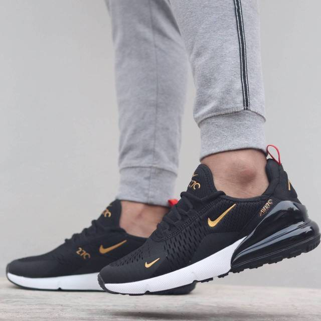 nike air black gold