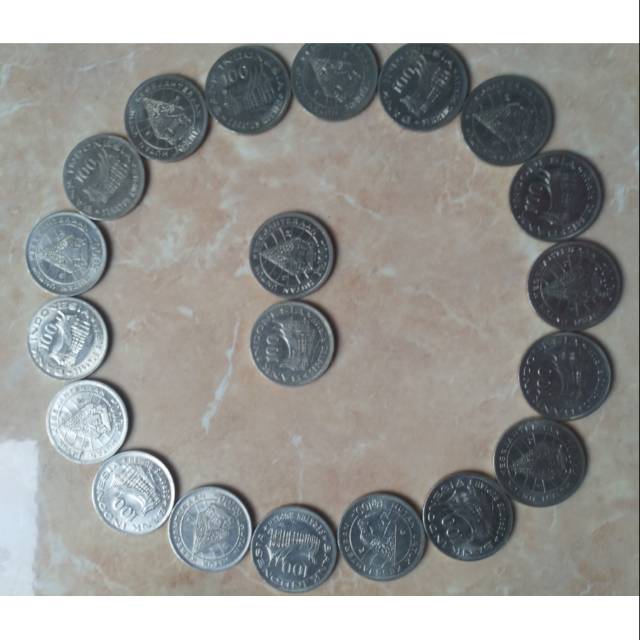 Uang koin Rp 100 tahun 1978 tipis, gambar wayang, rumah gadang