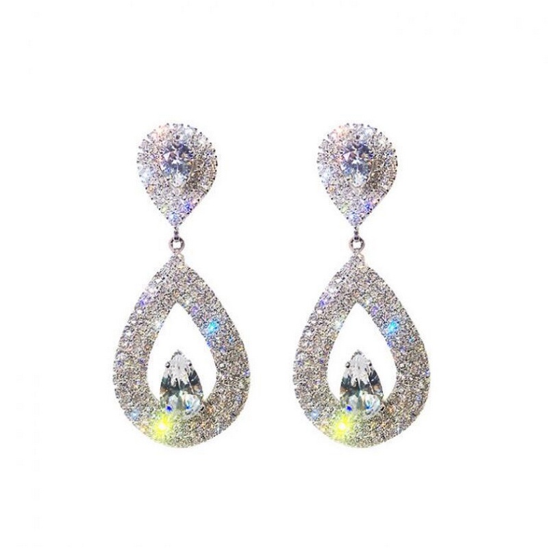 Gold and silver two-tone crystal-shaped pendant full of rhinestones and stud earrings
