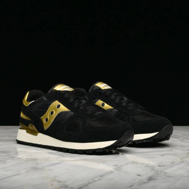 black and gold saucony