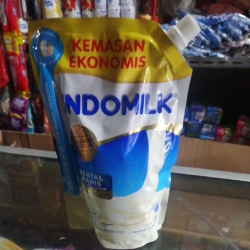 

Susu Kental Manis Indomilk putih kemasan pouch 545 gr