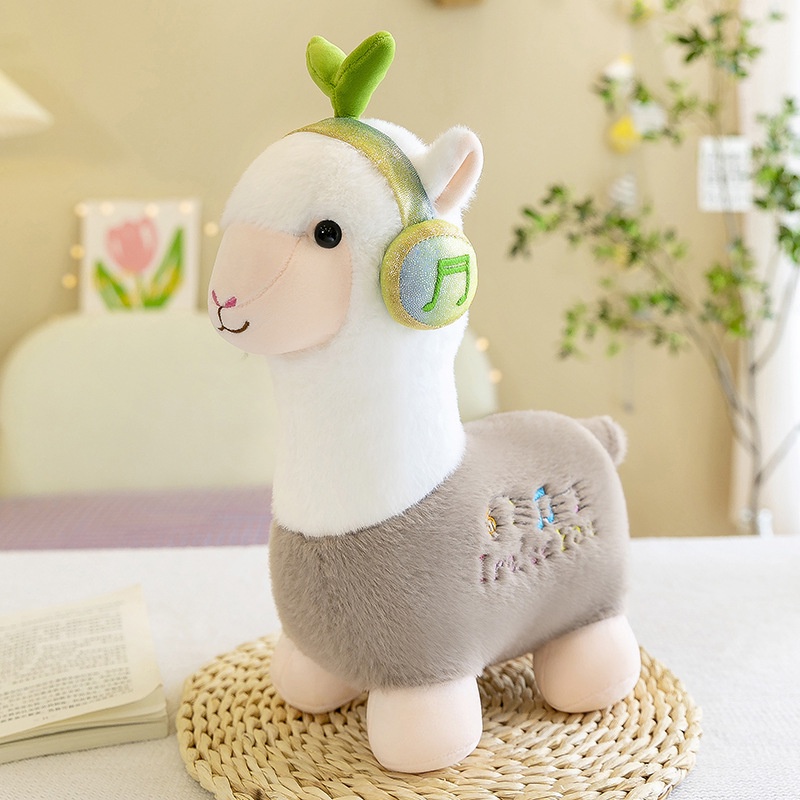 Boneka alpaca dengar musik