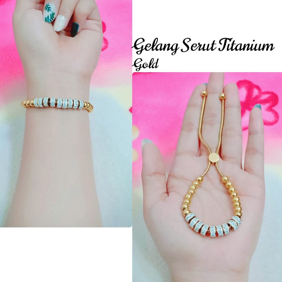 Gelang Serut Mata Putih Titanium Gold