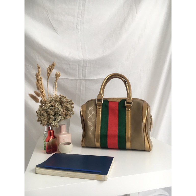 Handbag in gold by GUCCI (premium import)