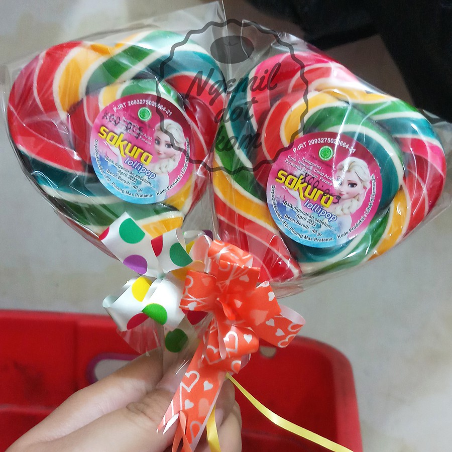 

PERMEN LOLLIPOP HATI 7cm x 7.5cm 60gr / LOLIPOP SEDANG / LOLIPOP MEDIUM