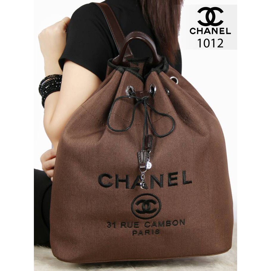 Tas wanita Chanel Deauville Canvas Drawstring Backpack Q02M
