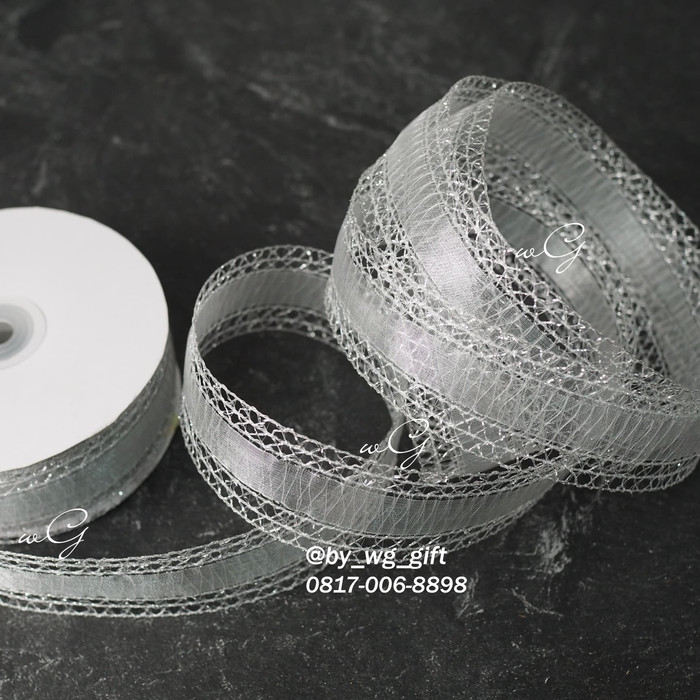 

Pita Silver - Renda; Lebar 3.8 cm; Panjang 25 Yard