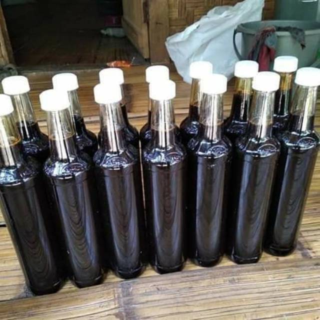 

Madu hitam pahit asli baduy kemasan botol.