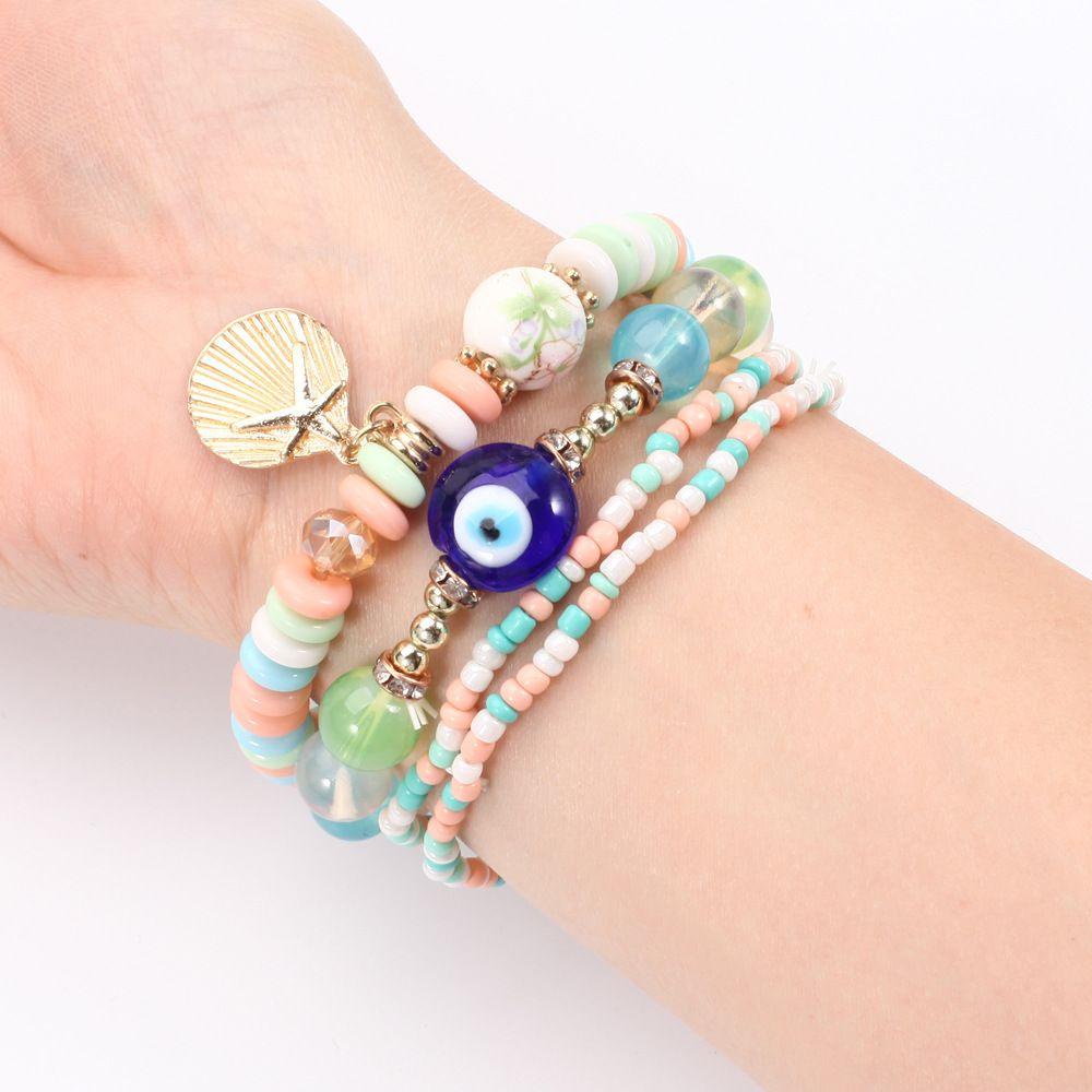 4pcs / set Gelang Multilayer Charm Kerang Mata Jahat Gaya Bohemia Untuk Hadiah