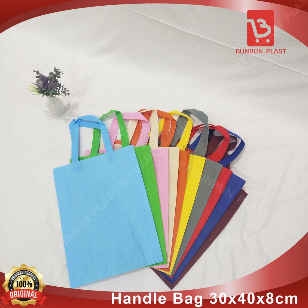 

TAS SPUNBOND HANDLE BAG 30X40X8CM PER LUSIN/12 PCS/TAS SOUVENIR