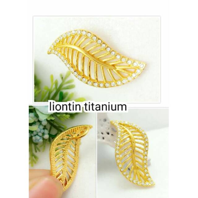 Liontin gold titanium daun mata zicron