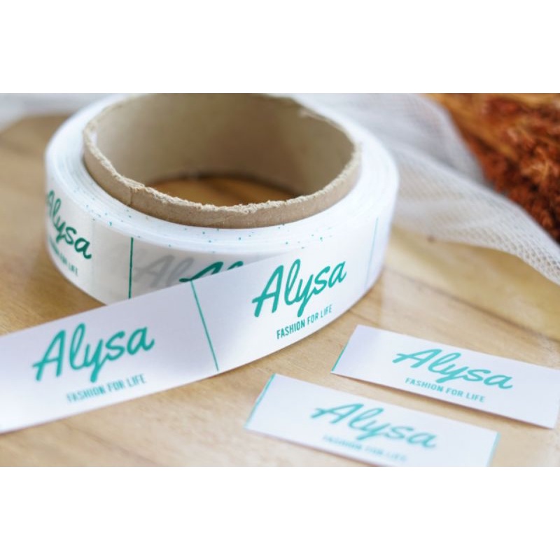 

LABEL BAJU HIJAB SATIN 1 ROLL isi 1000 pcs