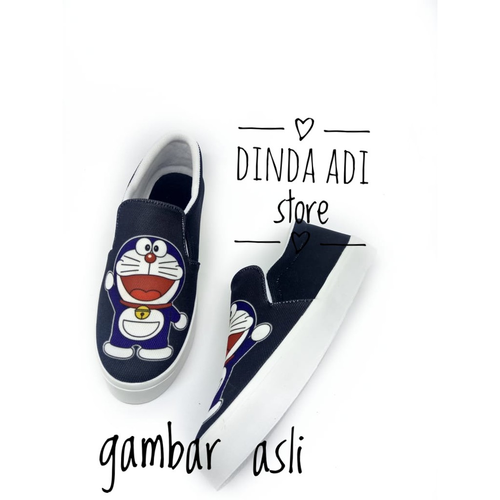 DINDA SEPATU WANITA SLIP ON DORAEMON REALPICT 100% MURAH - BIRU DAN HITAM