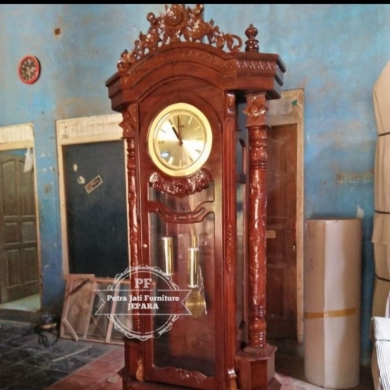 Jam berdiri hias masjid ukir Jepara kayu jati mebel Jepara