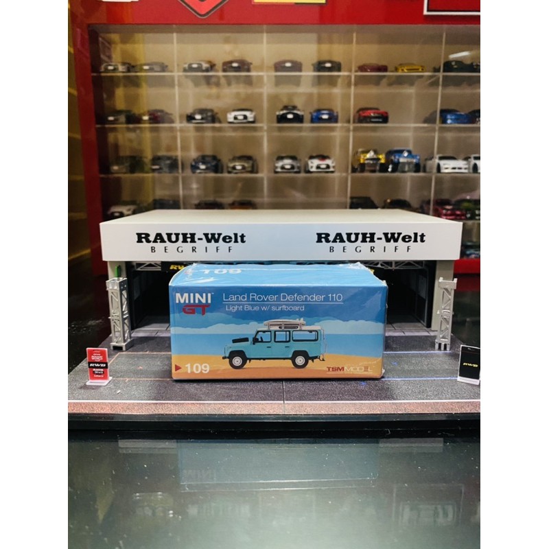 Mini GT Land Rover Defender 110 Light Blue with Surfboard Loose