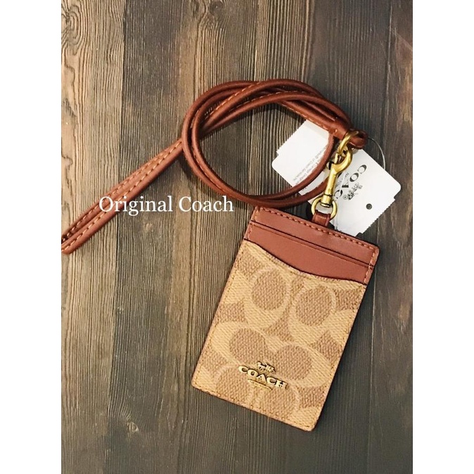 

Original Coach Lanyard Id Case Classic Brown Metal Logo Edition Terlaris
