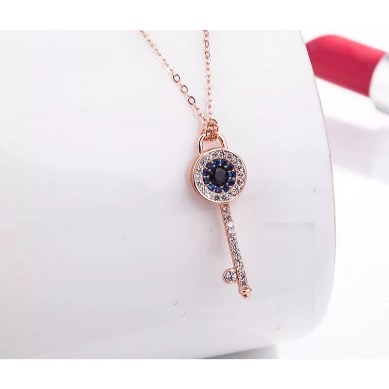 kalung liontin kunci titanium import