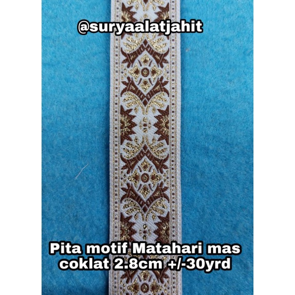 Pita motif Matahari mas coklat 2.8cm +/-30yrd TERBARU =rp.95.000/1Rol