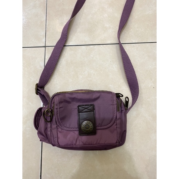 Tas selempang sling KIPLING ungu mini