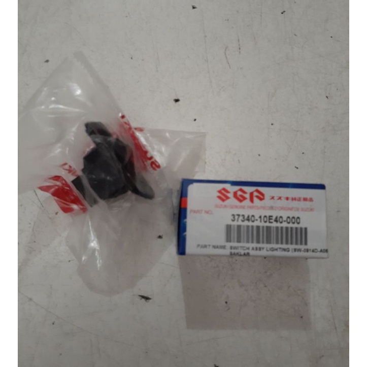 Tombol saklar lampu  spin  karisma supra x 125 original suzuki
