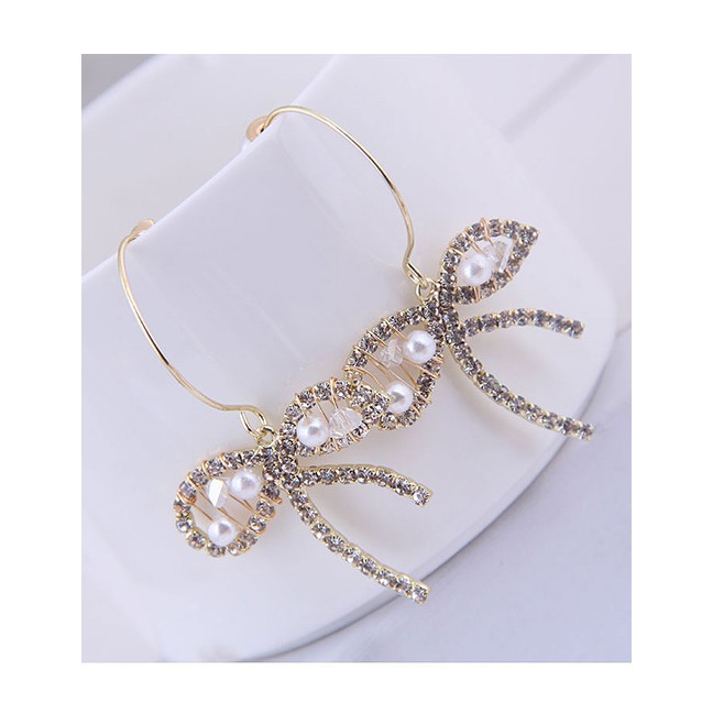 LRC Anting Tusuk Fashion Golden Pearl Earrings With Diamond Bow A60376