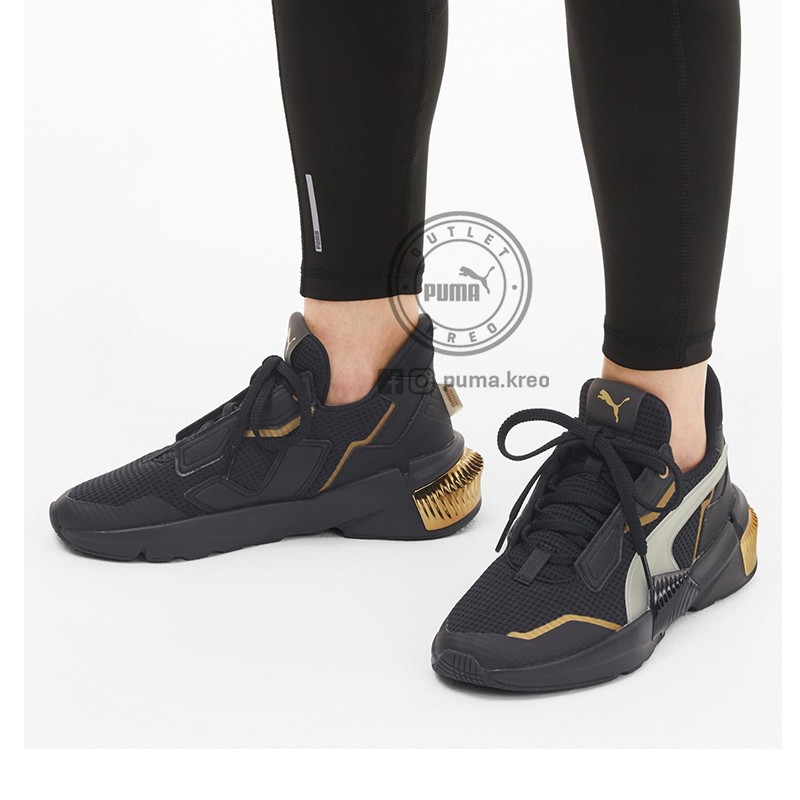 gold black puma