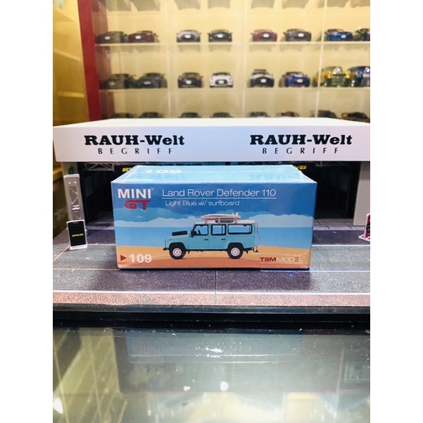 Mini GT No 109 Land Rover Defender 110 Light Blue with Surfboard