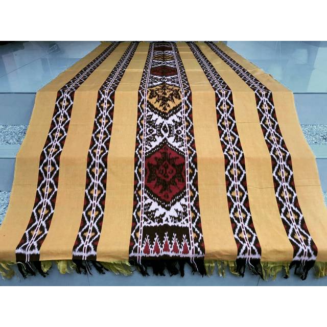 Kain tenun jepara warna kuning motif manado