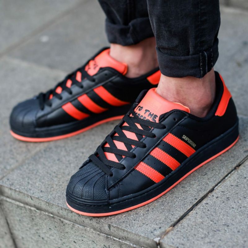 ADIDAS SUPERSTAR LACELESS FROM THE COURT TO THE STREET FULLBLACK ORANGE