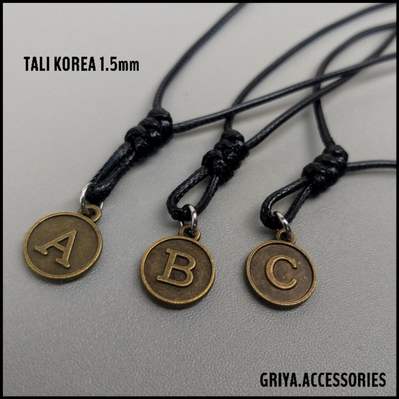 Kalung Tali Korea Hitam Inisial Huruf Bulat ( Bronze )