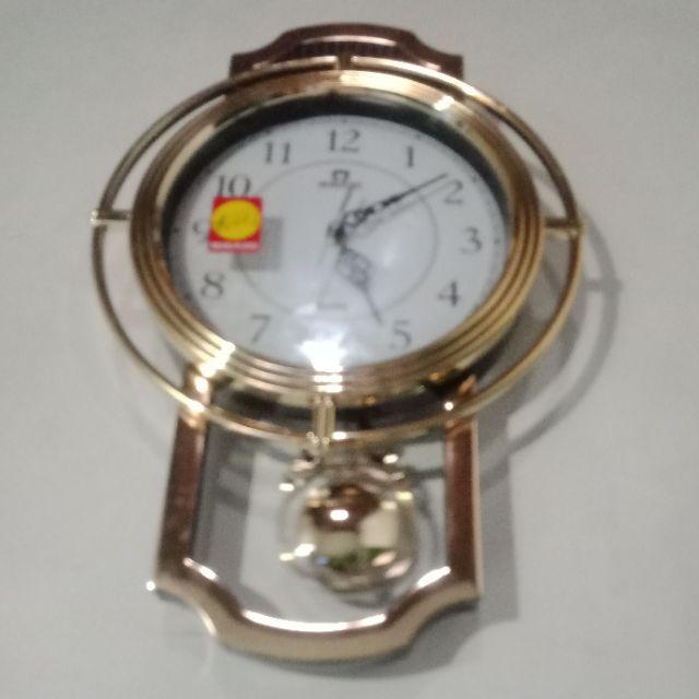 Jam Dinding Mirado Musik Bandul Goyang 937 Diameter 33cm