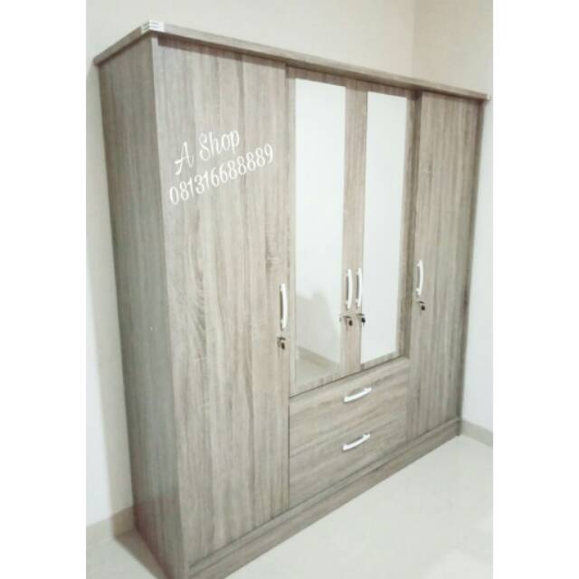 Lemari pakaian 4 pintu murah mewah minimalis serat kayu. Jumbo dengan cermin.