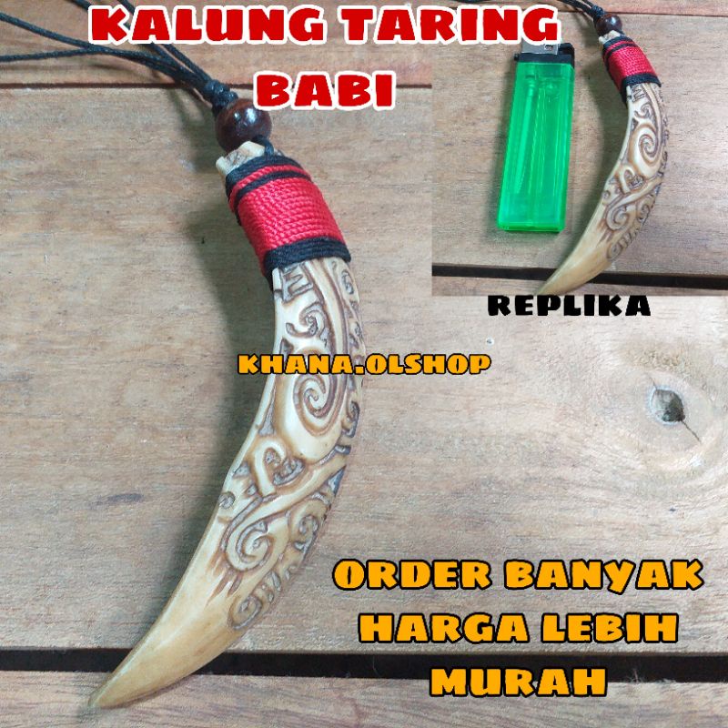 kalung taring babi ukir kalimantan