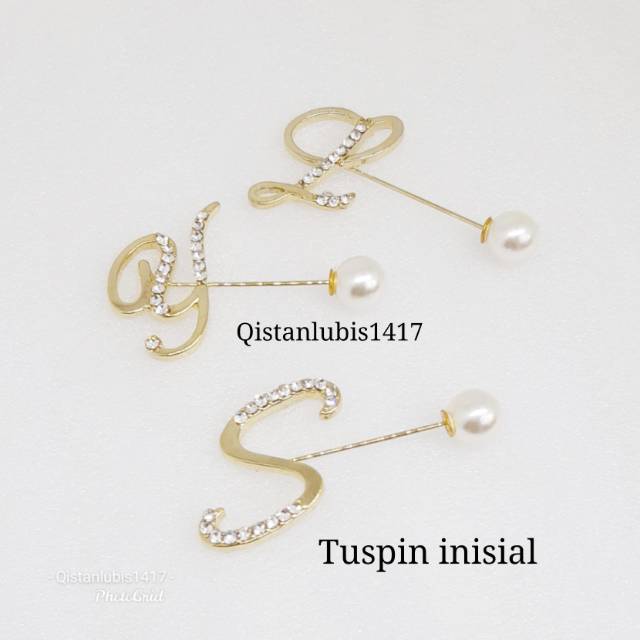 Tuspin huruf gold