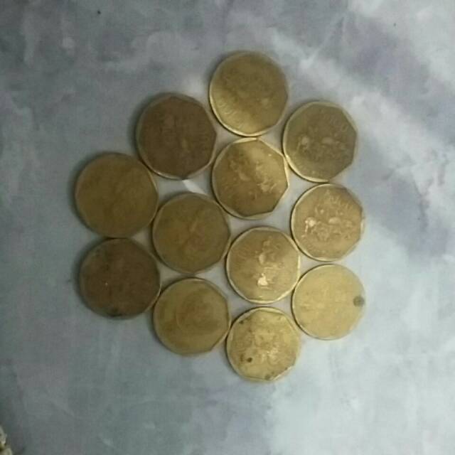 Uang logam 100 rupiah kuningan kerapan sapi