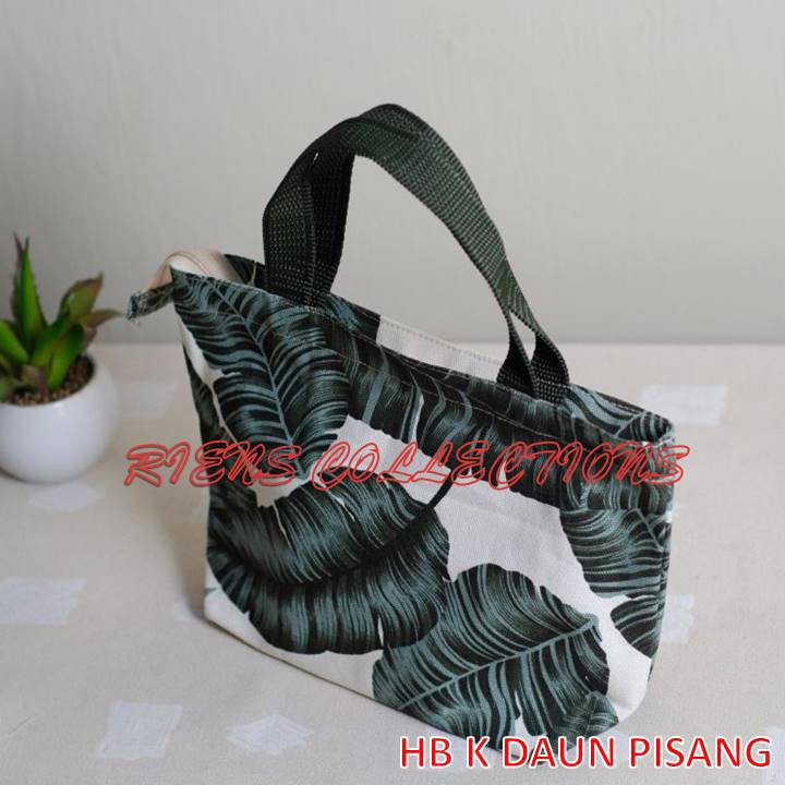 RIENS COLLECTIONS. HANDBAG KECIL BAHAN KANVAS MOTIF DAUN PISANG. TAS KANVAS