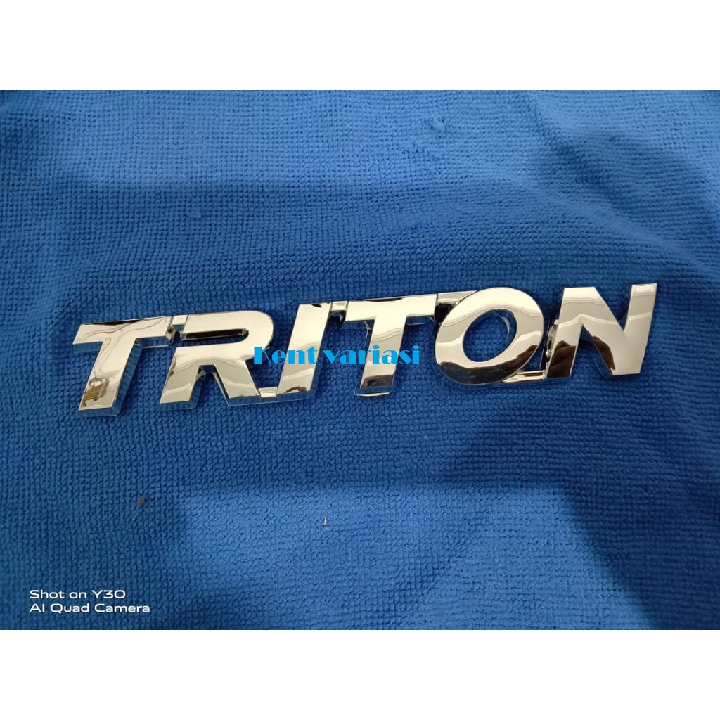 Emblem tulisan Triton